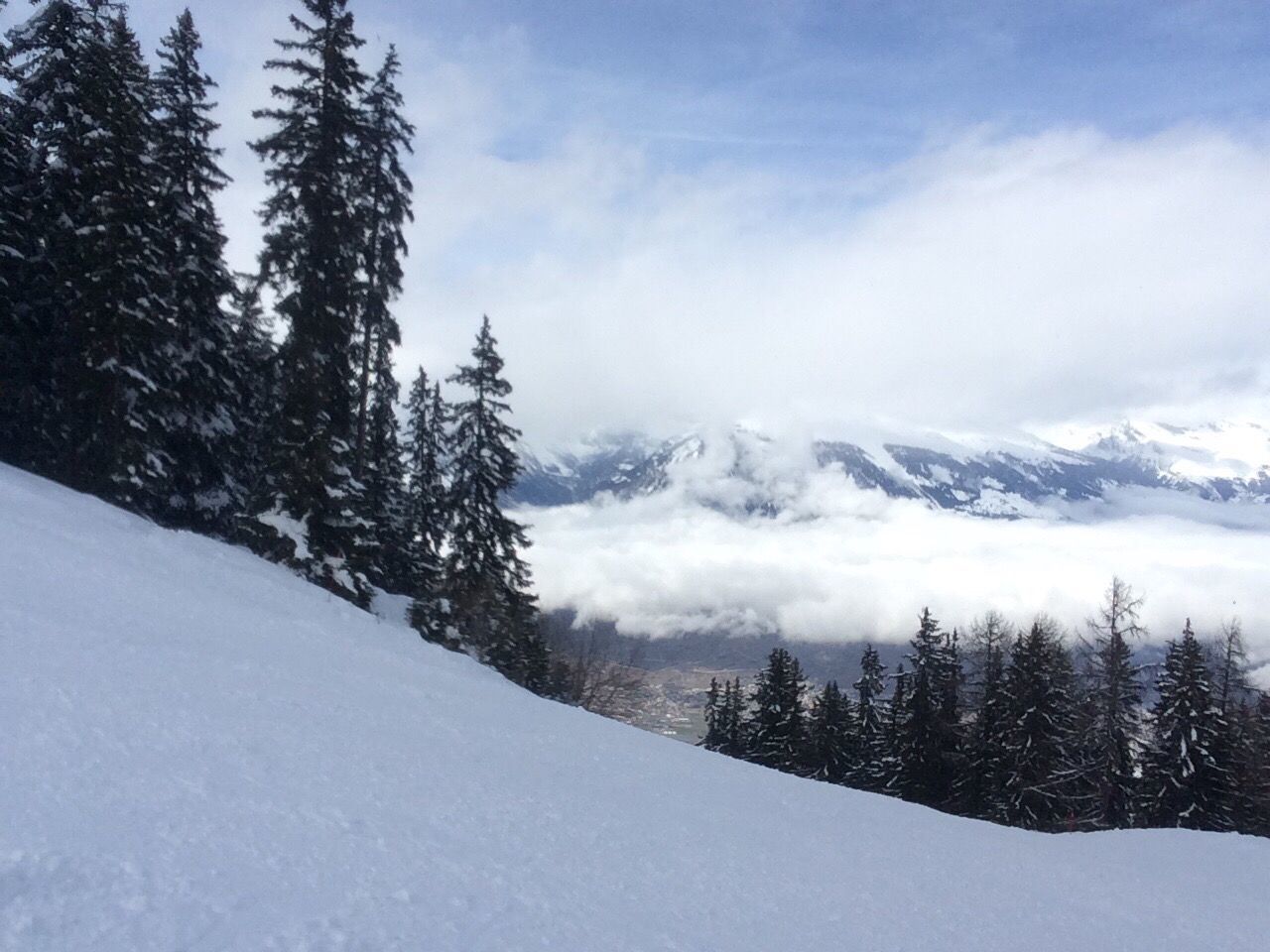 Scenic view of snow covered mountains against sky