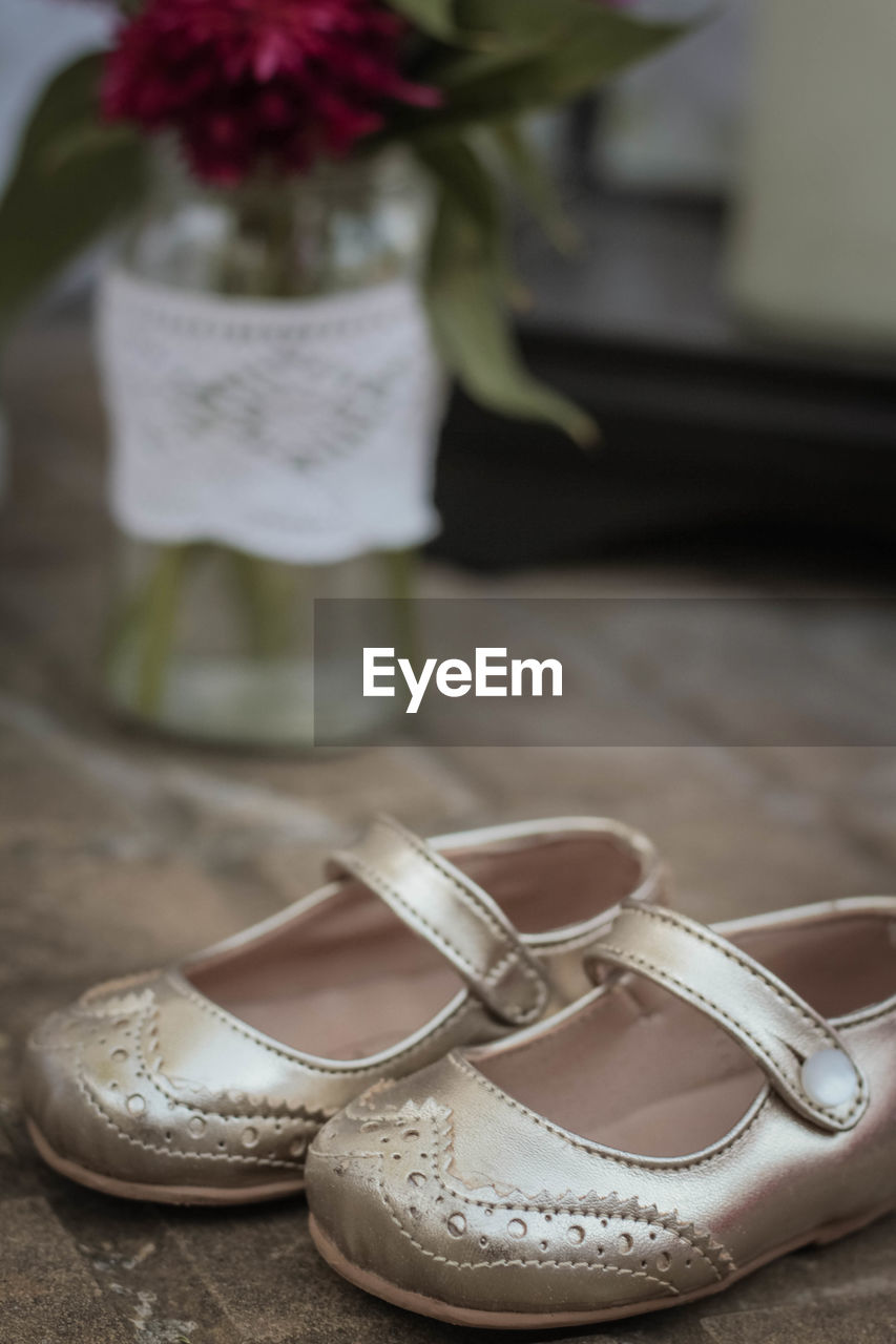 Close-up of shoes on table