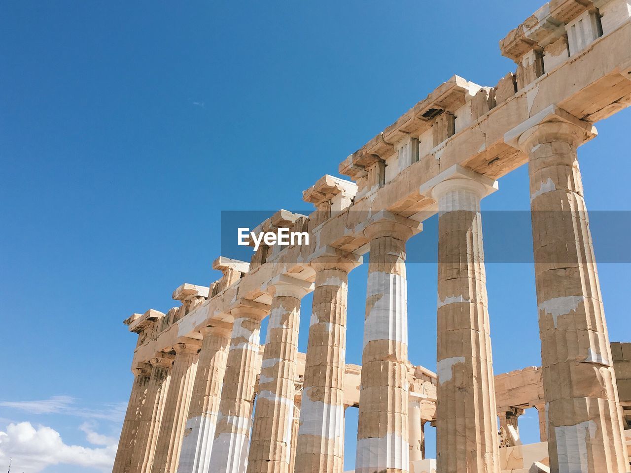 Low angle view of temple against clear blue sky