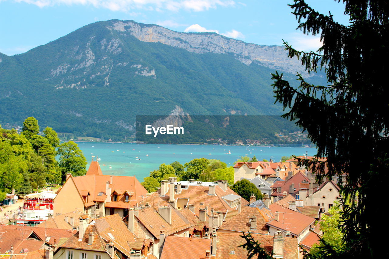 High angle view of townscape by mountains