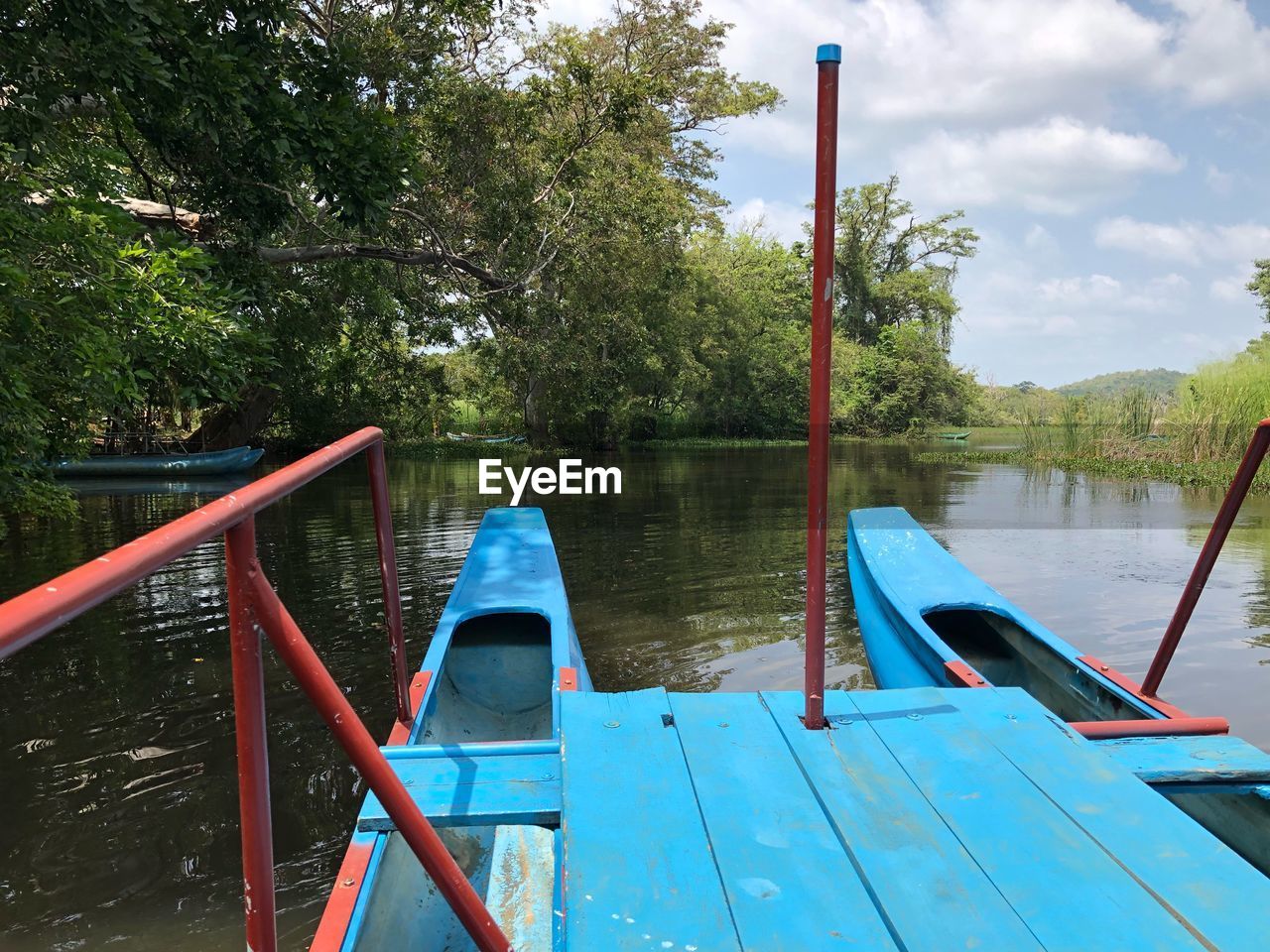 WOODEN POST IN LAKE