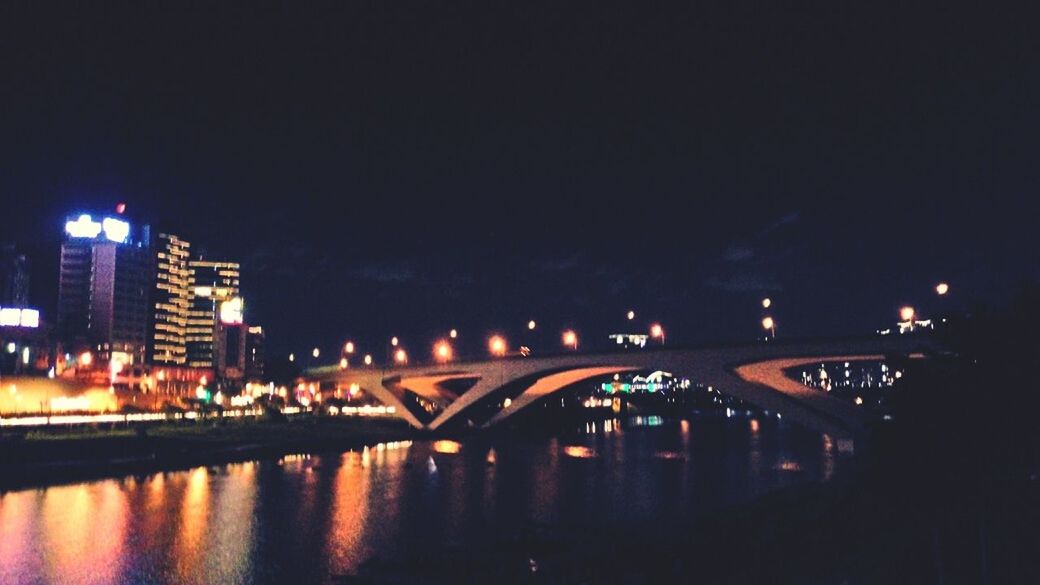 REFLECTION OF ILLUMINATED BUILDINGS IN WATER