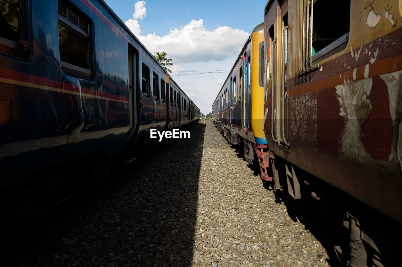 Train on railroad track against sky