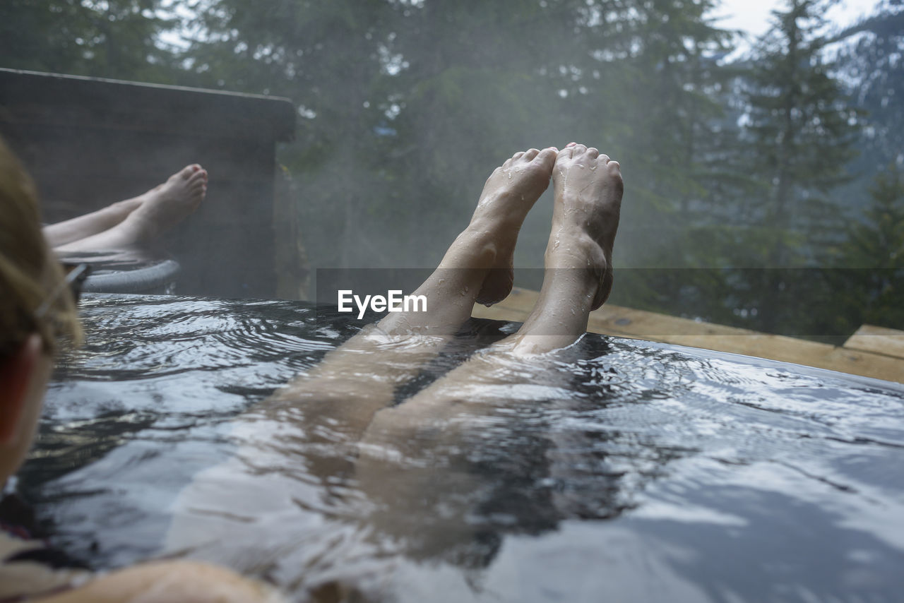 Cropped image of woman in hot spring