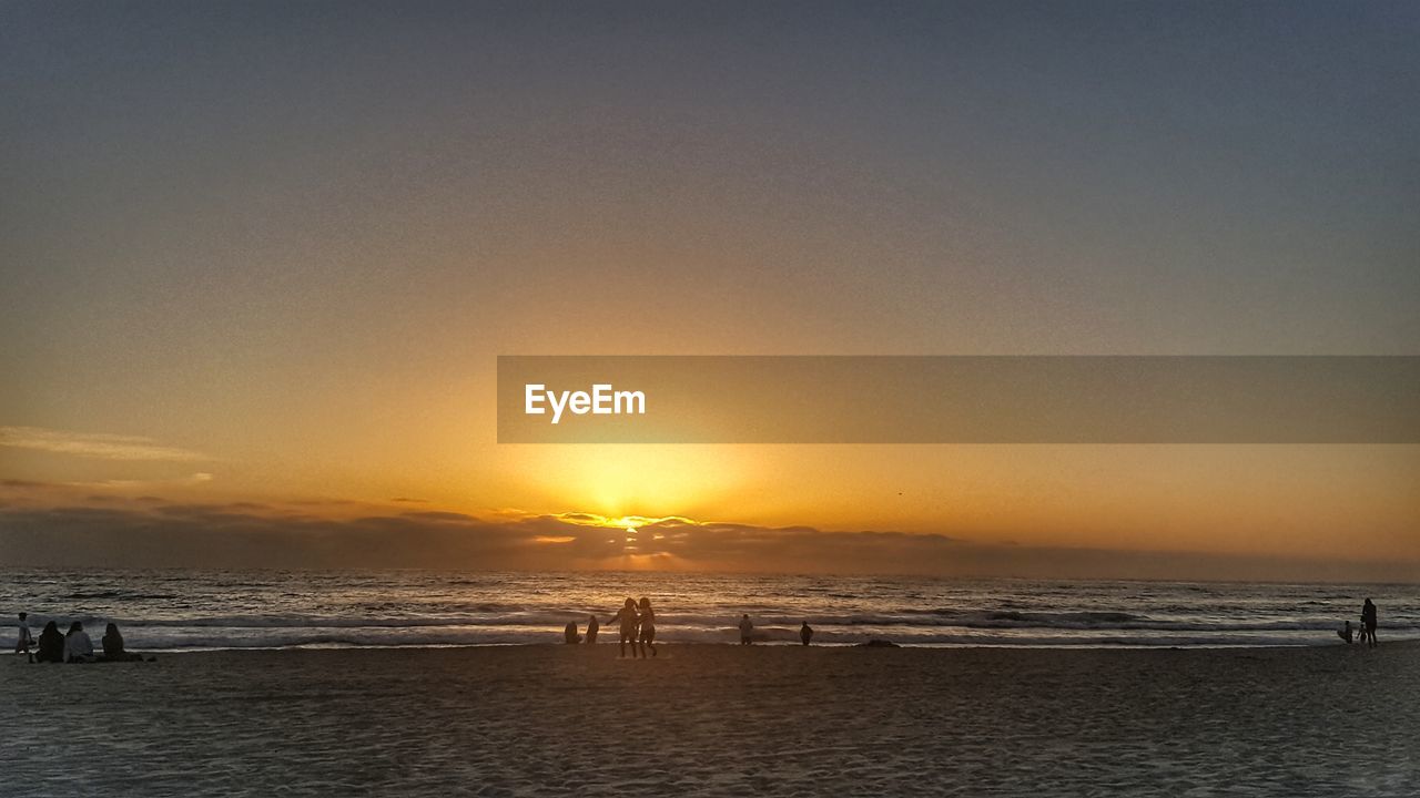 Scenic view of sea against clear sky during sunset