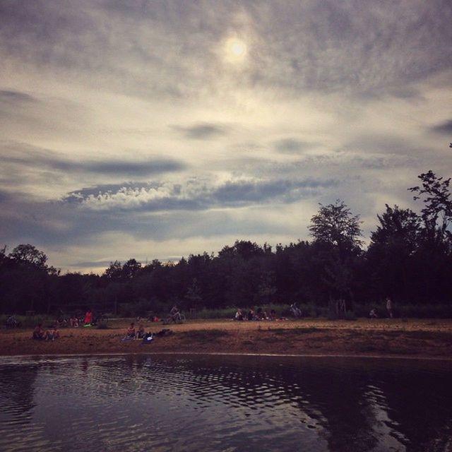 SCENIC VIEW OF LAKE AGAINST CLOUDY SKY