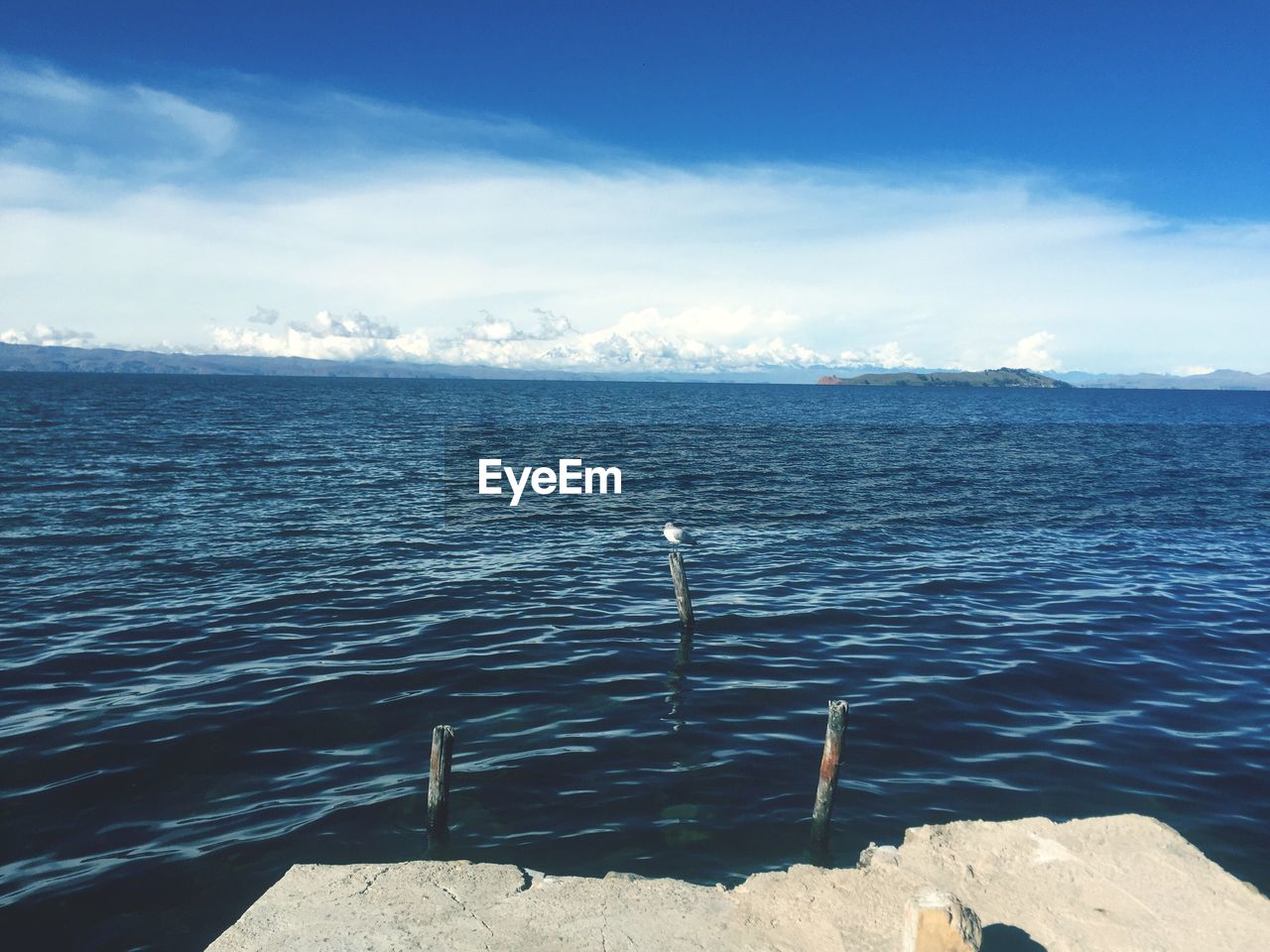 Scenic view of sea against blue sky