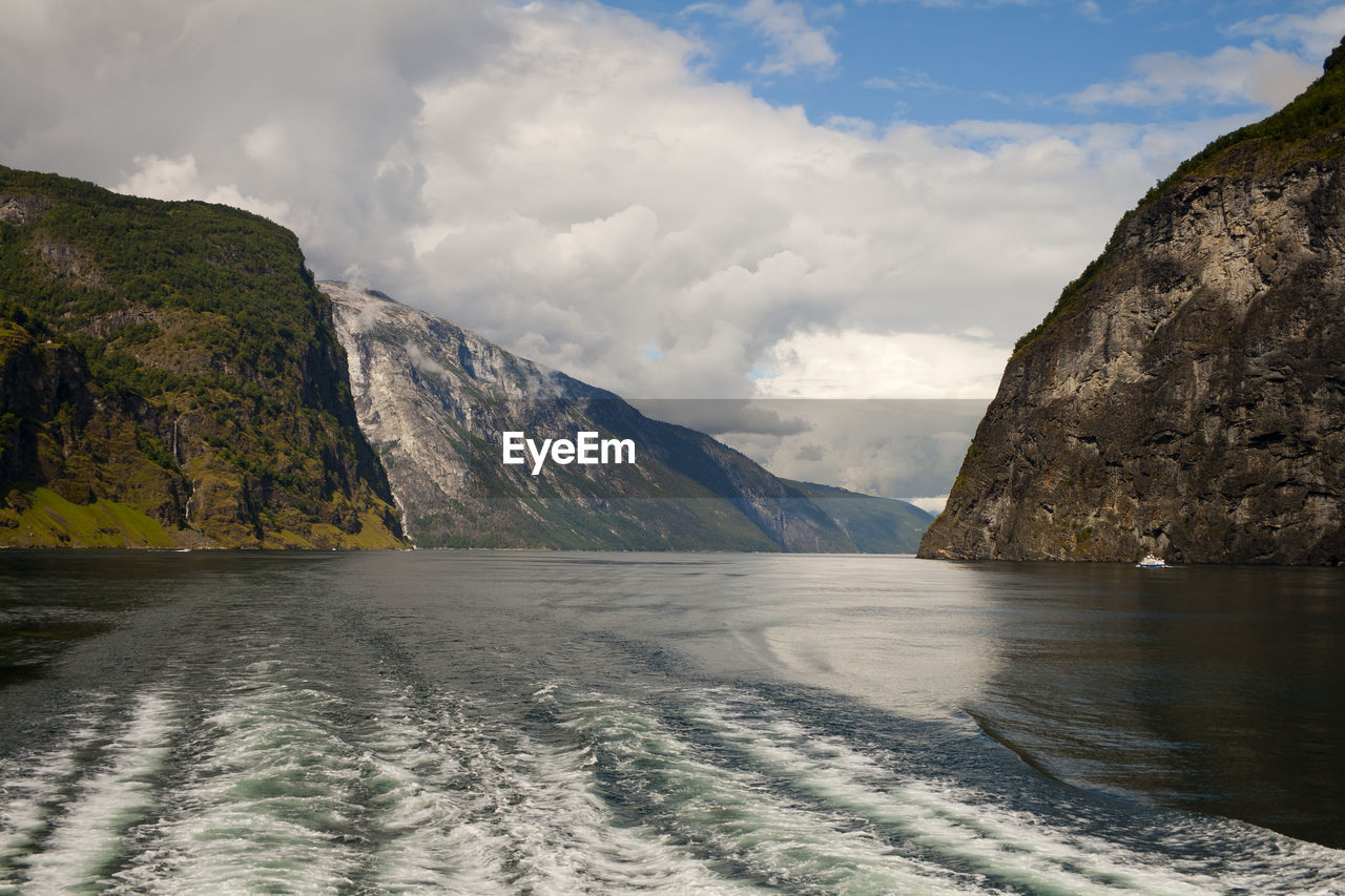 Scenic view of mountains and sea against sky