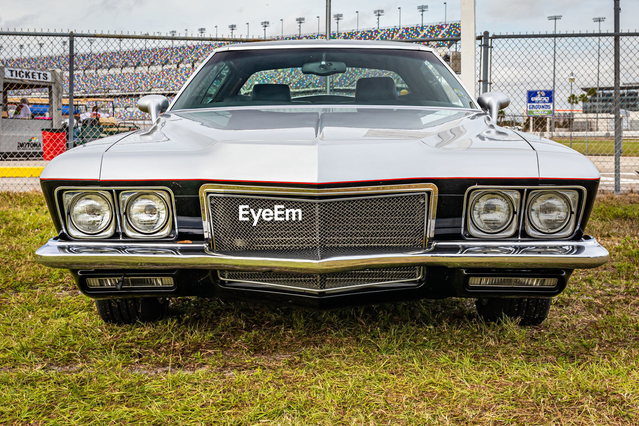 VINTAGE CAR ON FIELD