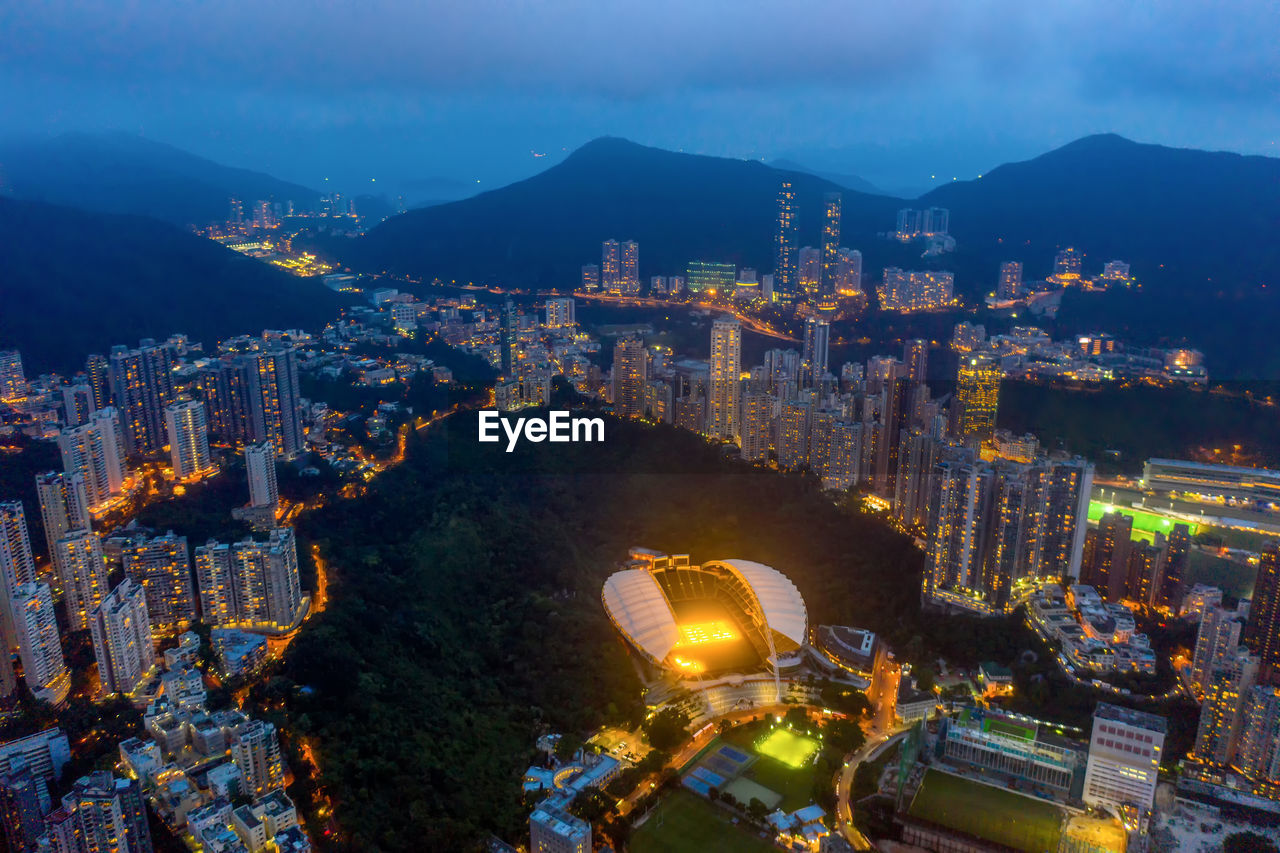 High angle view of city lit up at night