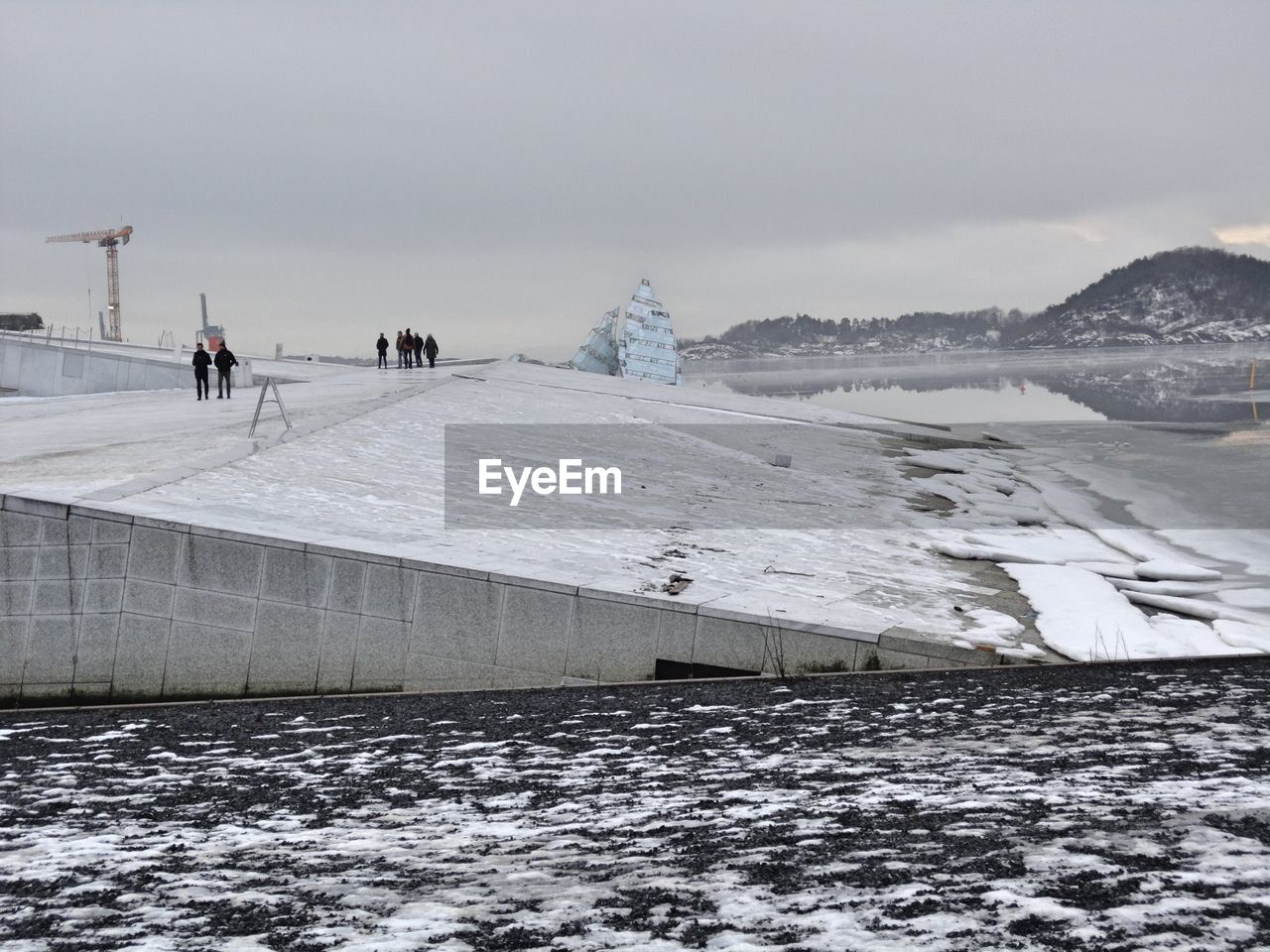 VIEW OF FROZEN SEA AGAINST SKY