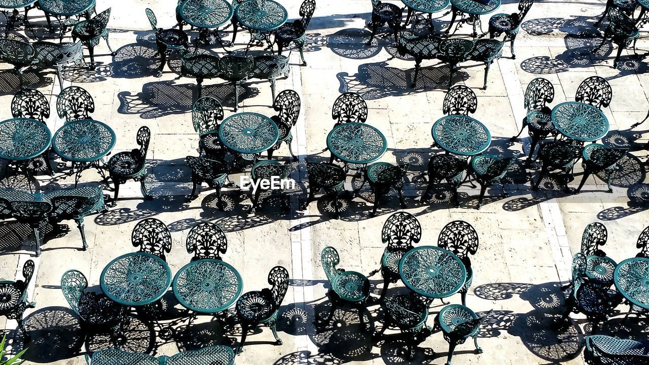 Full frame shot of chairs and tables at sidewalk cafe