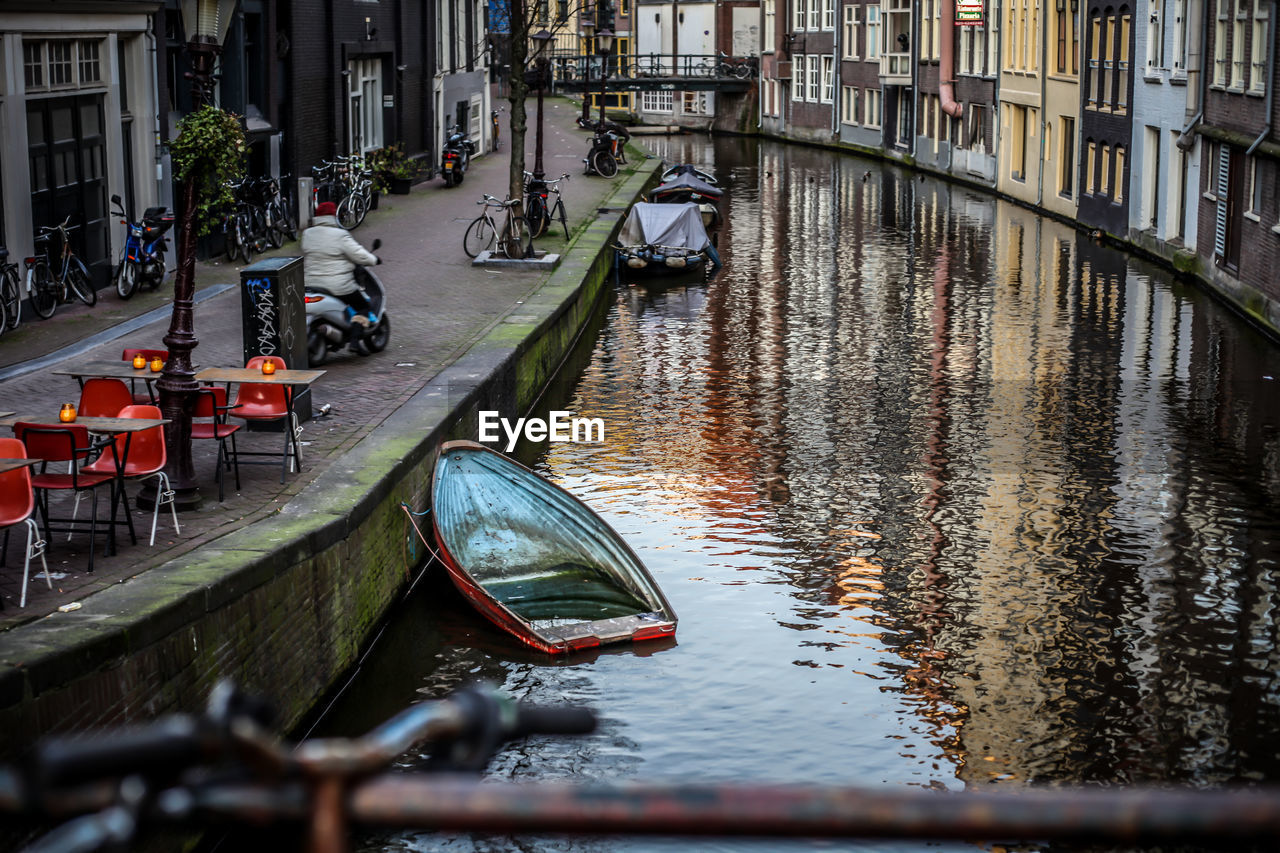 Boats moored in canal