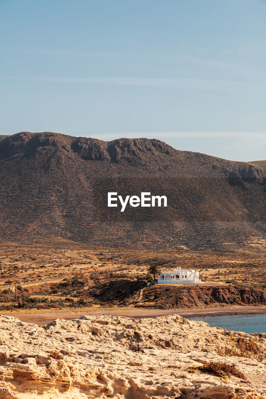 SCENIC VIEW OF LANDSCAPE AND MOUNTAINS AGAINST SKY