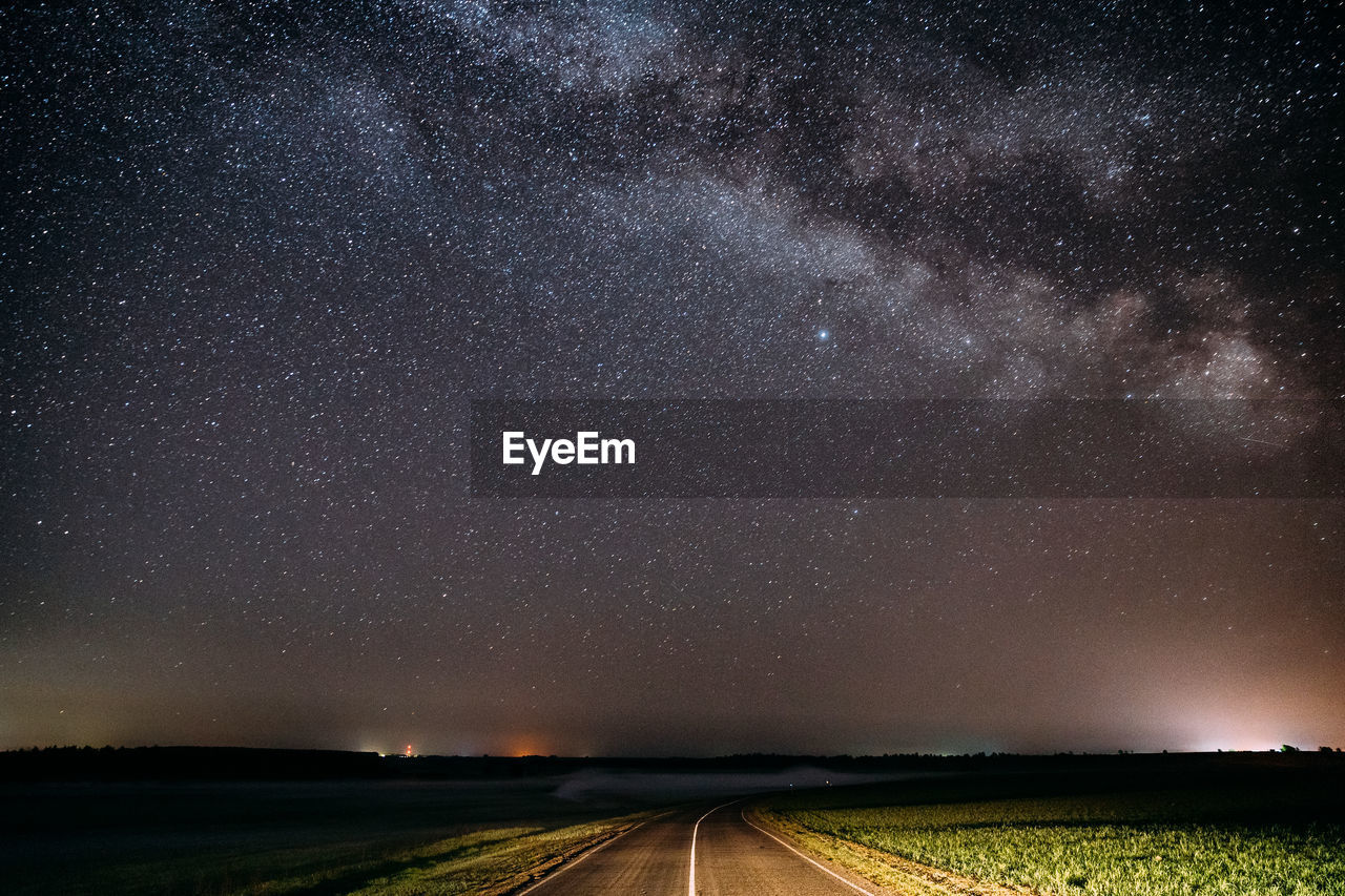 scenic view of field against sky at night