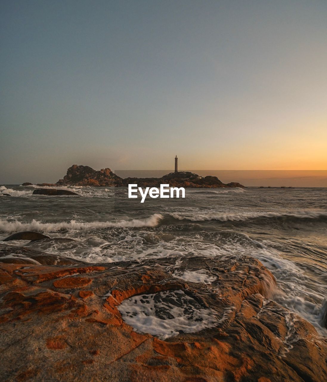 Scenic view of sea against clear sky during sunset