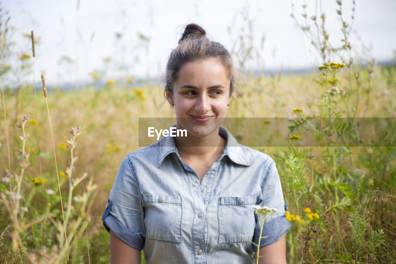 Portrait of smiling woman on field