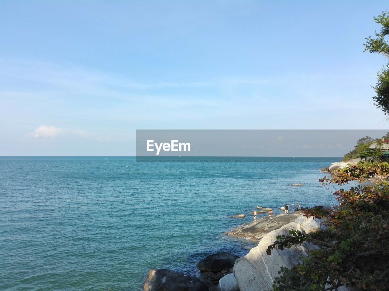 Scenic view of sea against blue sky