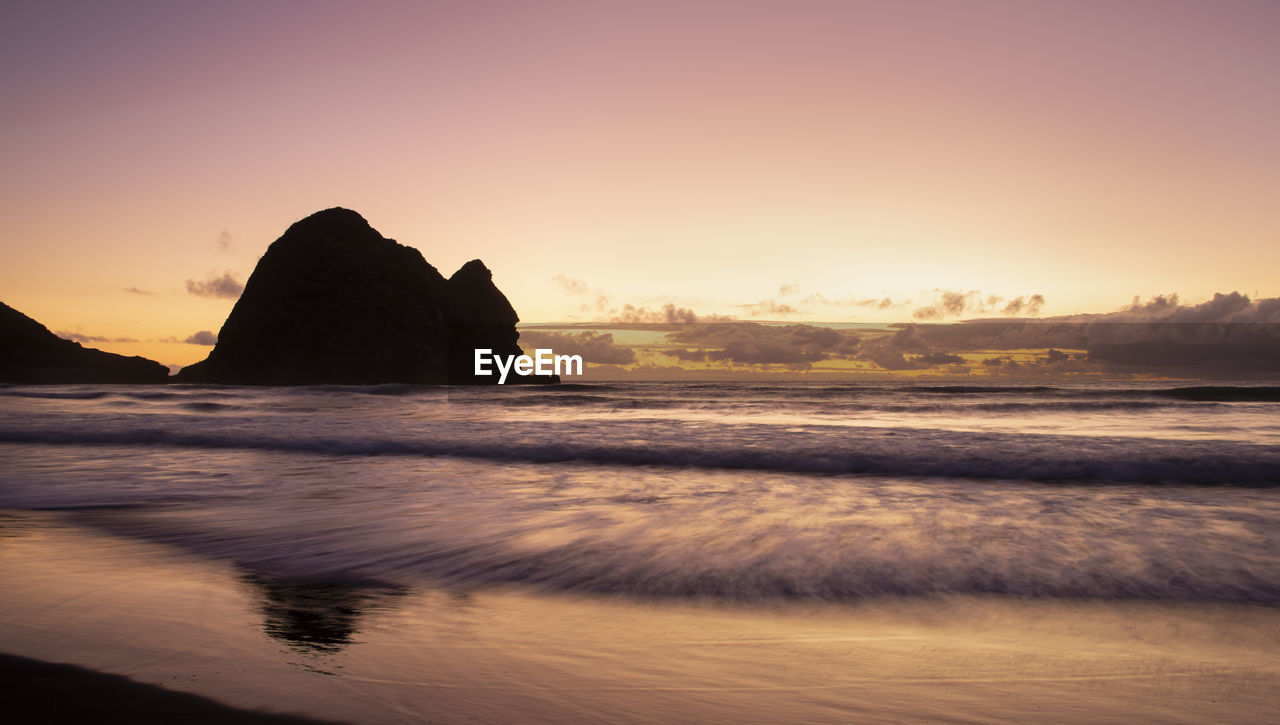 SCENIC VIEW OF SEA DURING SUNSET