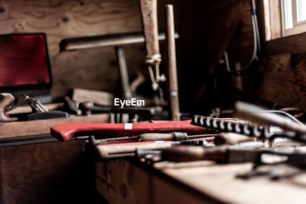 Close-up of tools on workbench