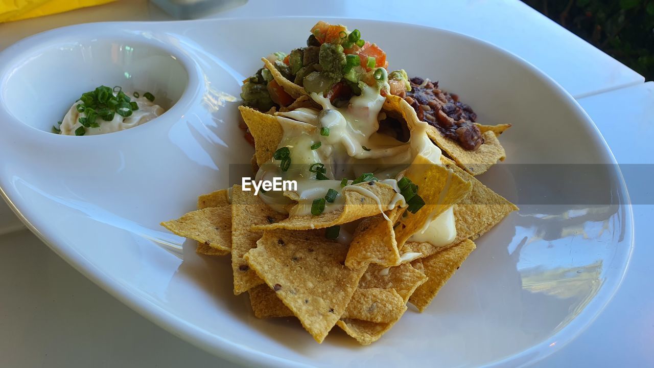 food and drink, food, meal, vegetarian food, dish, plate, fast food, healthy eating, no people, lunch, freshness, vegetable, cuisine, high angle view, breakfast, tortilla chip, produce, wellbeing, nacho chip