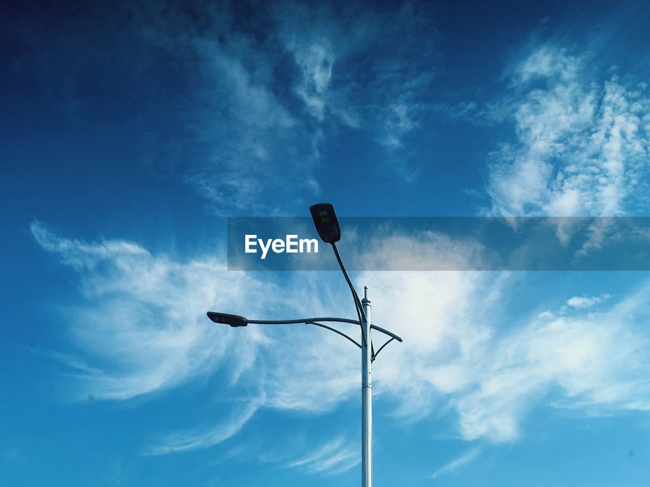 LOW ANGLE VIEW OF STREET LIGHT AGAINST SKY