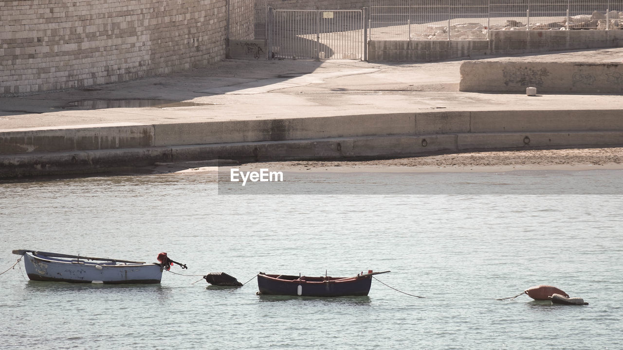 Boats moored in water