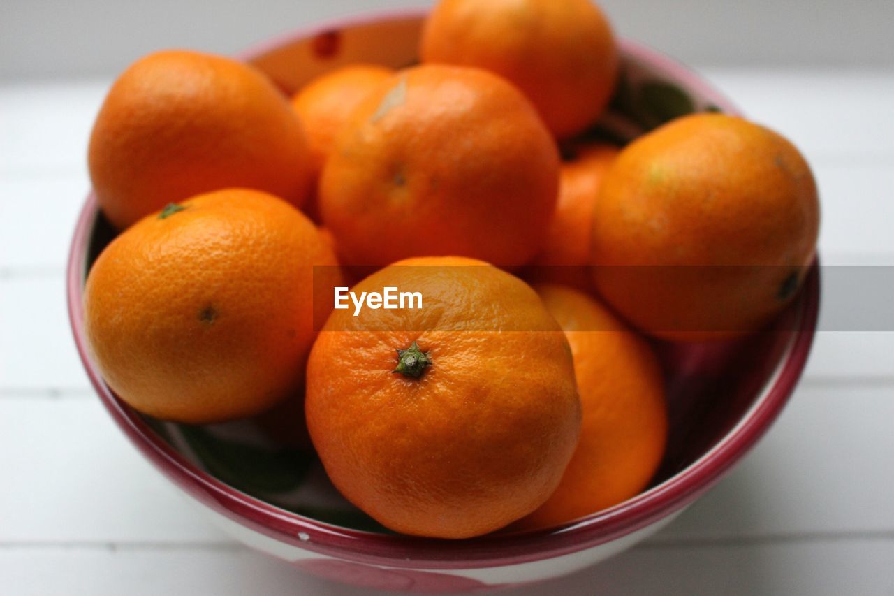 Close-up of fruits in bowl on table