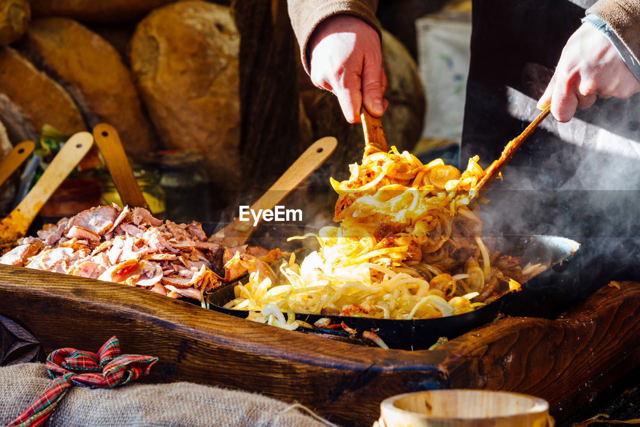 Midsection of man preparing food