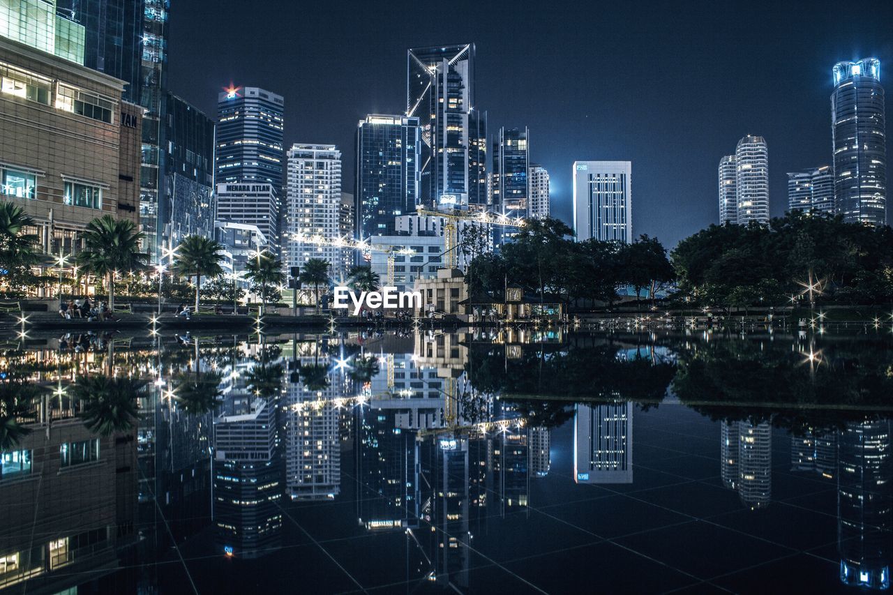 Illuminated buildings in city at night