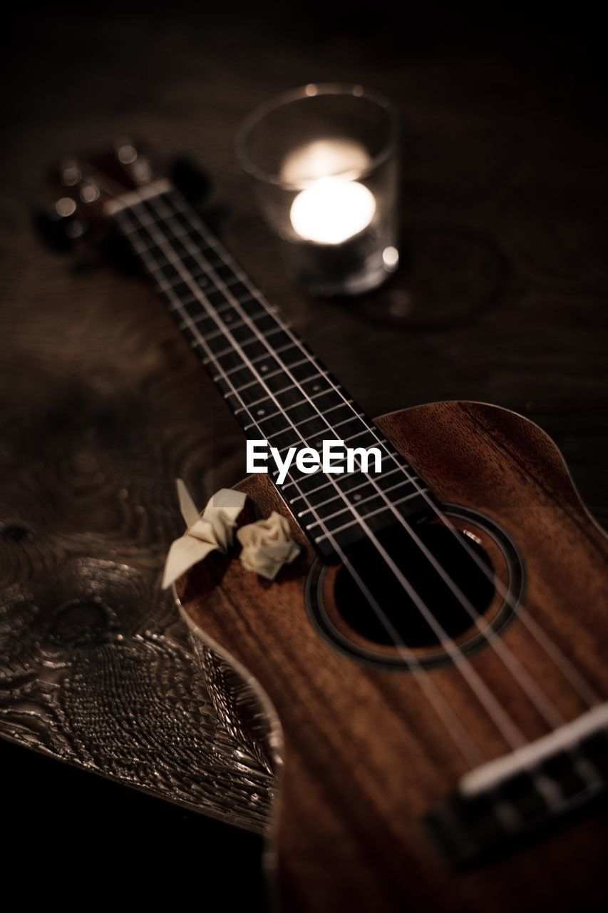 Close-up of guitar on table