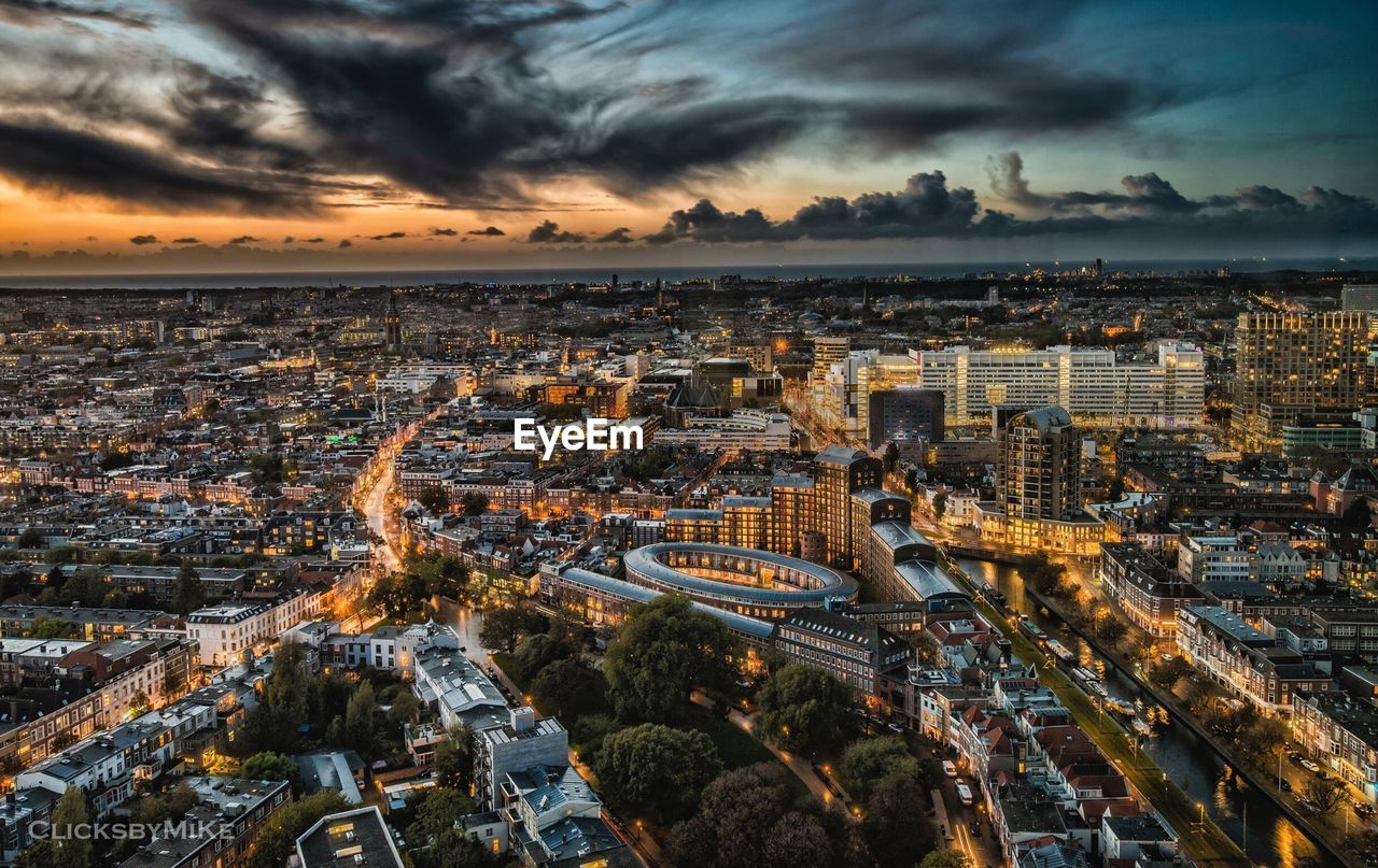 High angle view of city at sunset