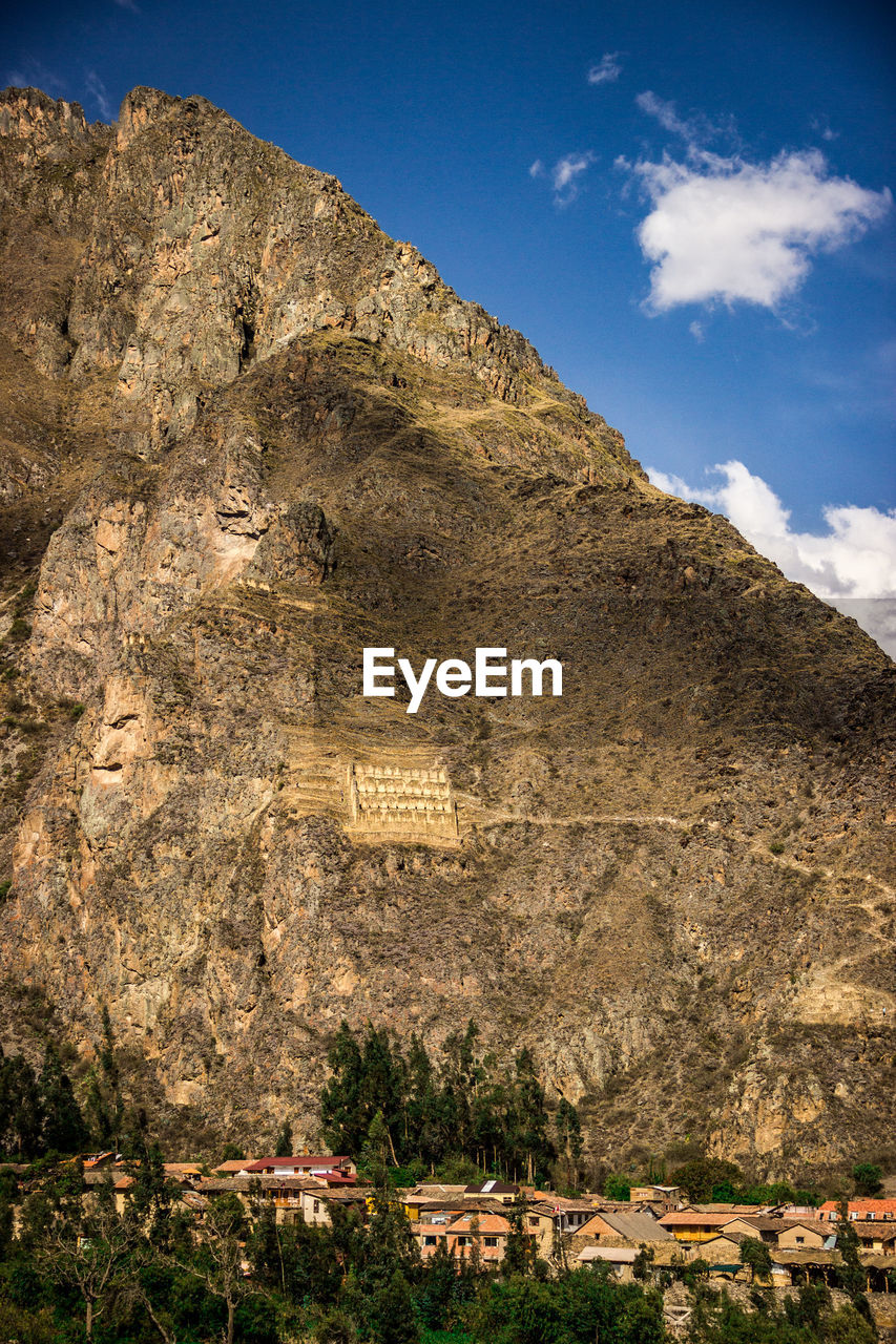 LOW ANGLE VIEW OF ROCK FORMATIONS ON MOUNTAIN