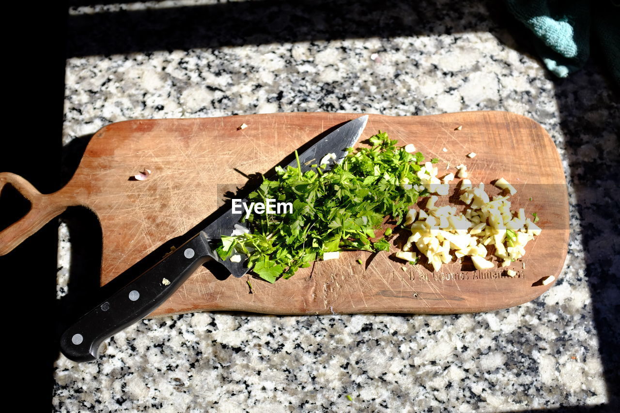 High angle view of chopped vegetables on cutting board