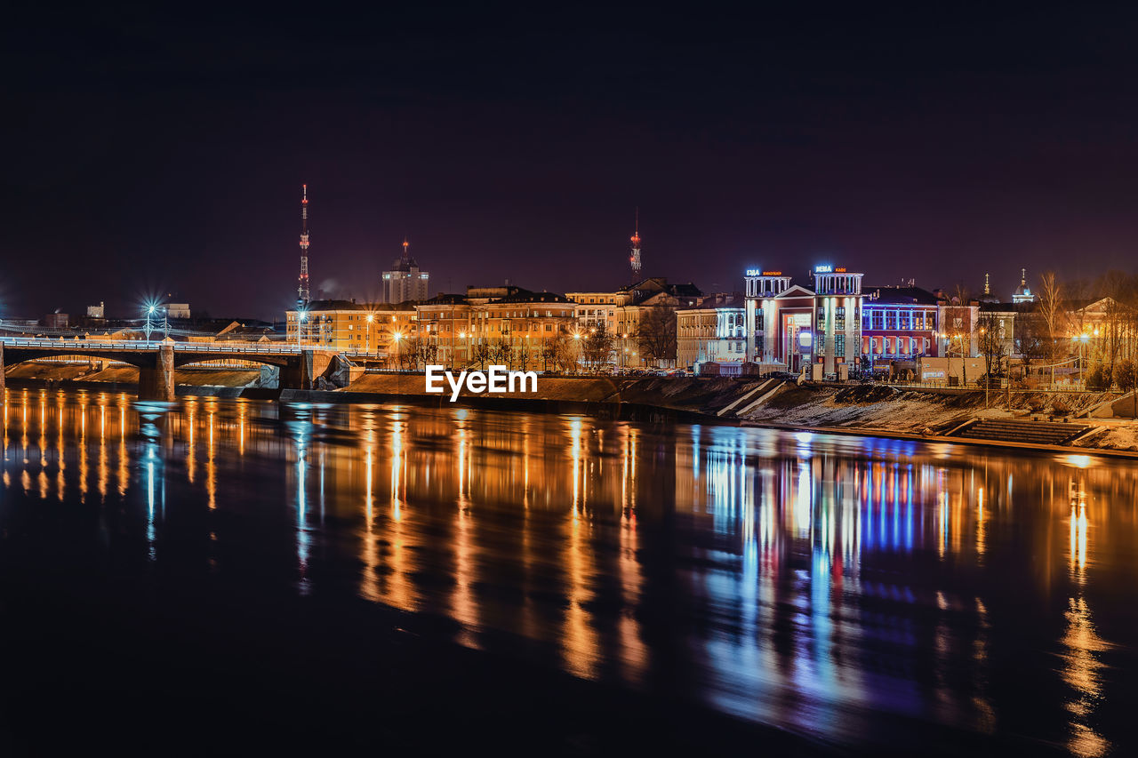 Illuminated city at waterfront