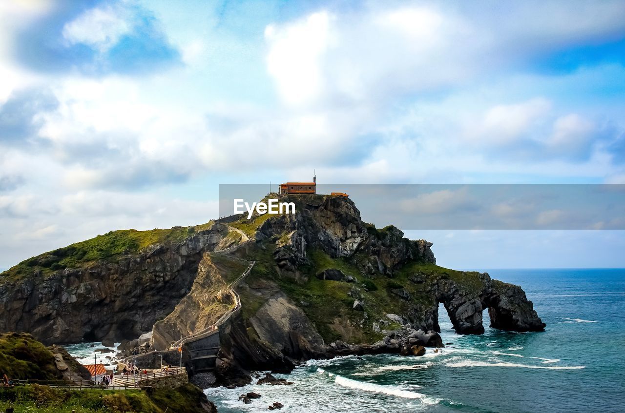 Scenic view of sea and rocks against sky