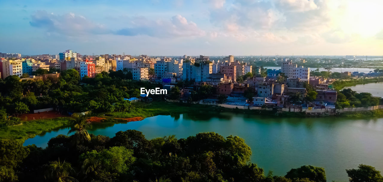 HIGH ANGLE VIEW OF CITY BUILDINGS AGAINST SKY