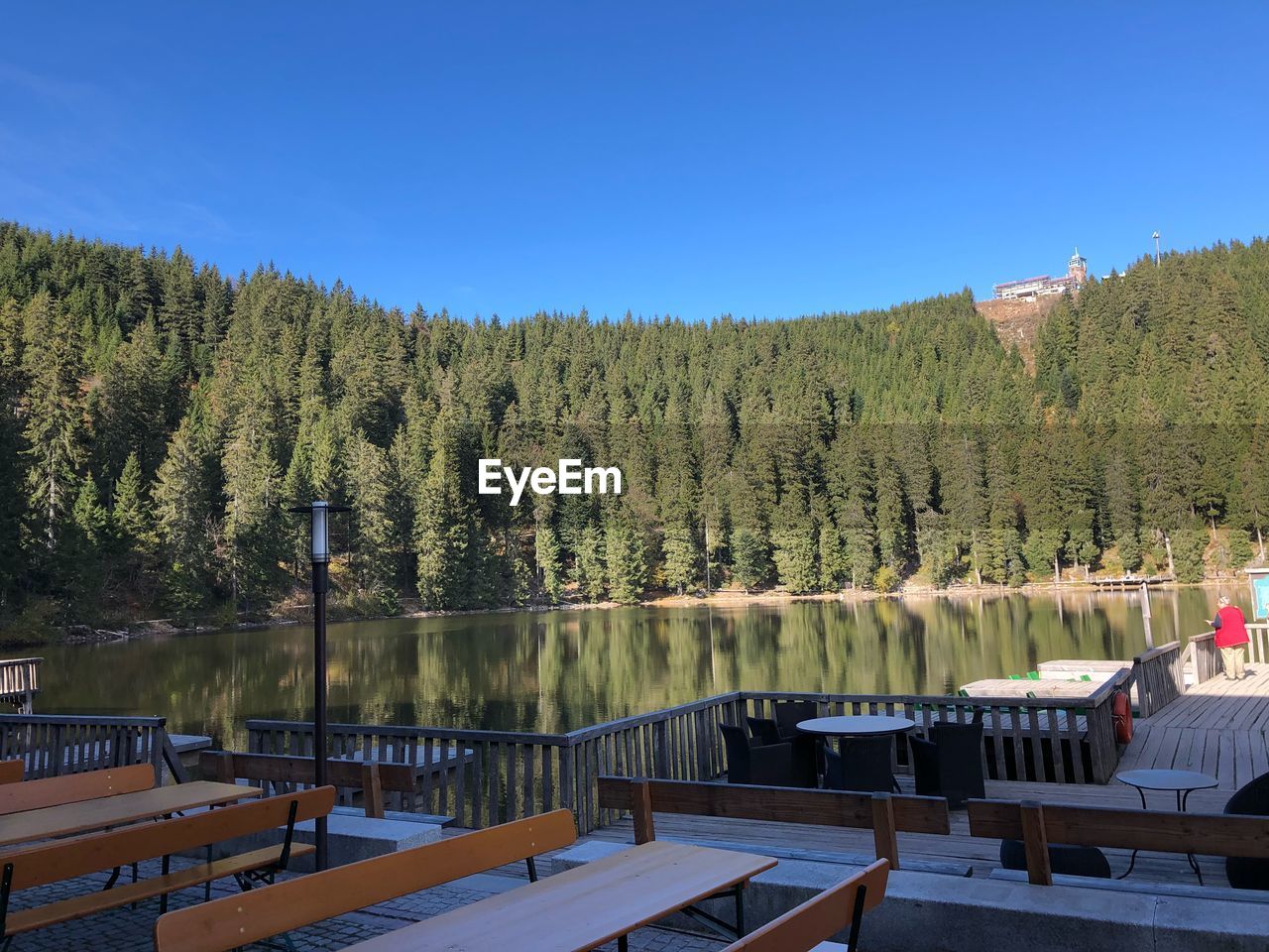 Scenic view of lake against clear blue sky