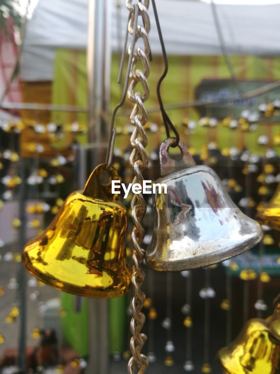 CLOSE-UP OF CHAIN SWING RIDE IN PARK