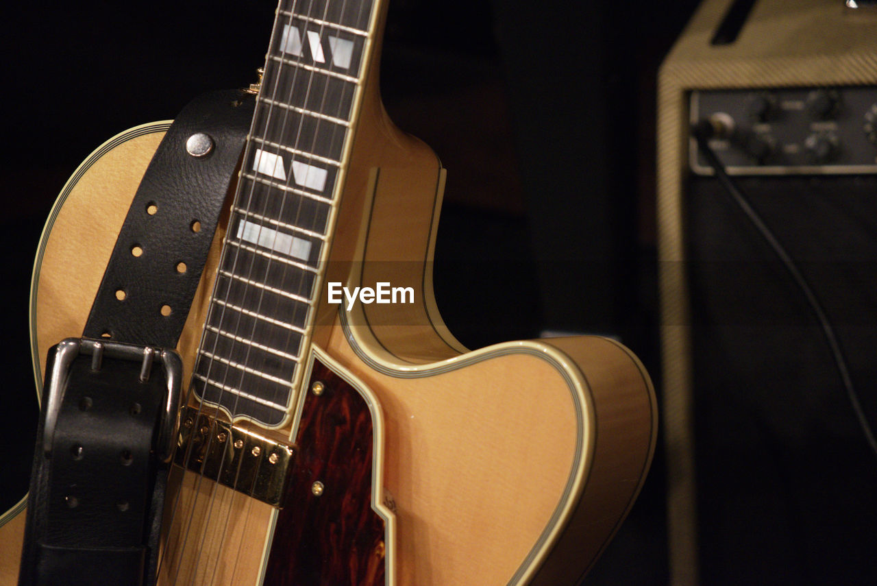 Close-up of belt on guitar