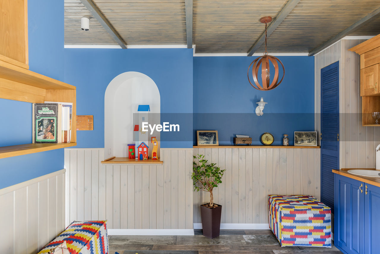 Blue interior of a village house with ethno decoration