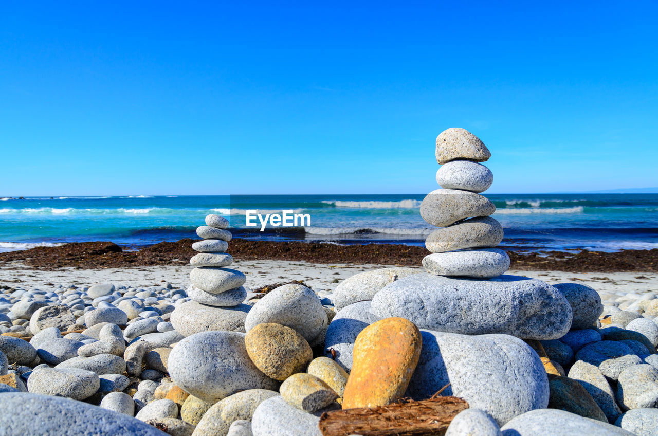 Stones stapled on pebble beach