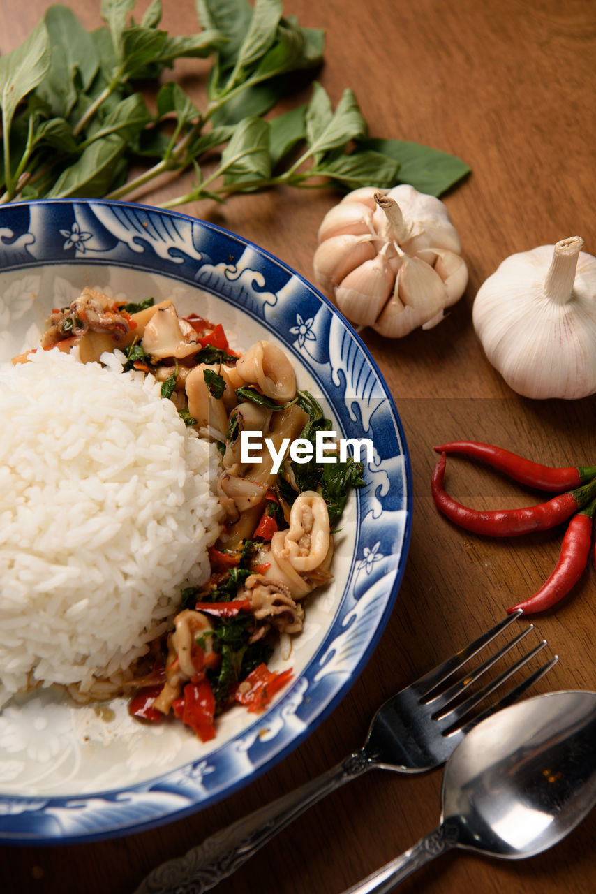 Stir fried basil with thai style minced squid and ingredients