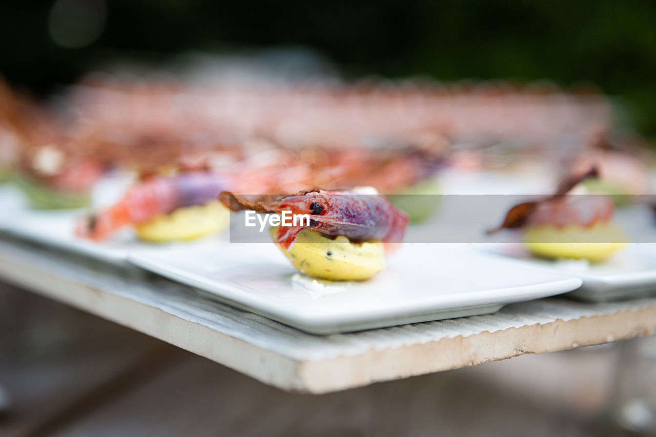 Close-up of finger food in plate on table. gourmet buffet. high angle view of food.