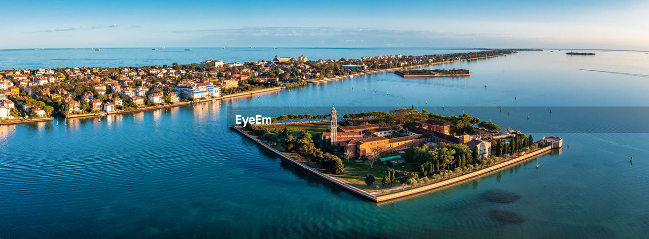 Flying over small venice islands in venetian lagoon.