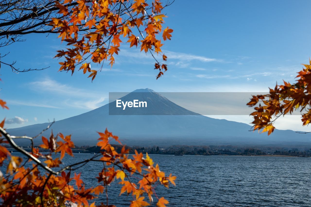 Scenic view of snowcapped mountains against sky during autumn