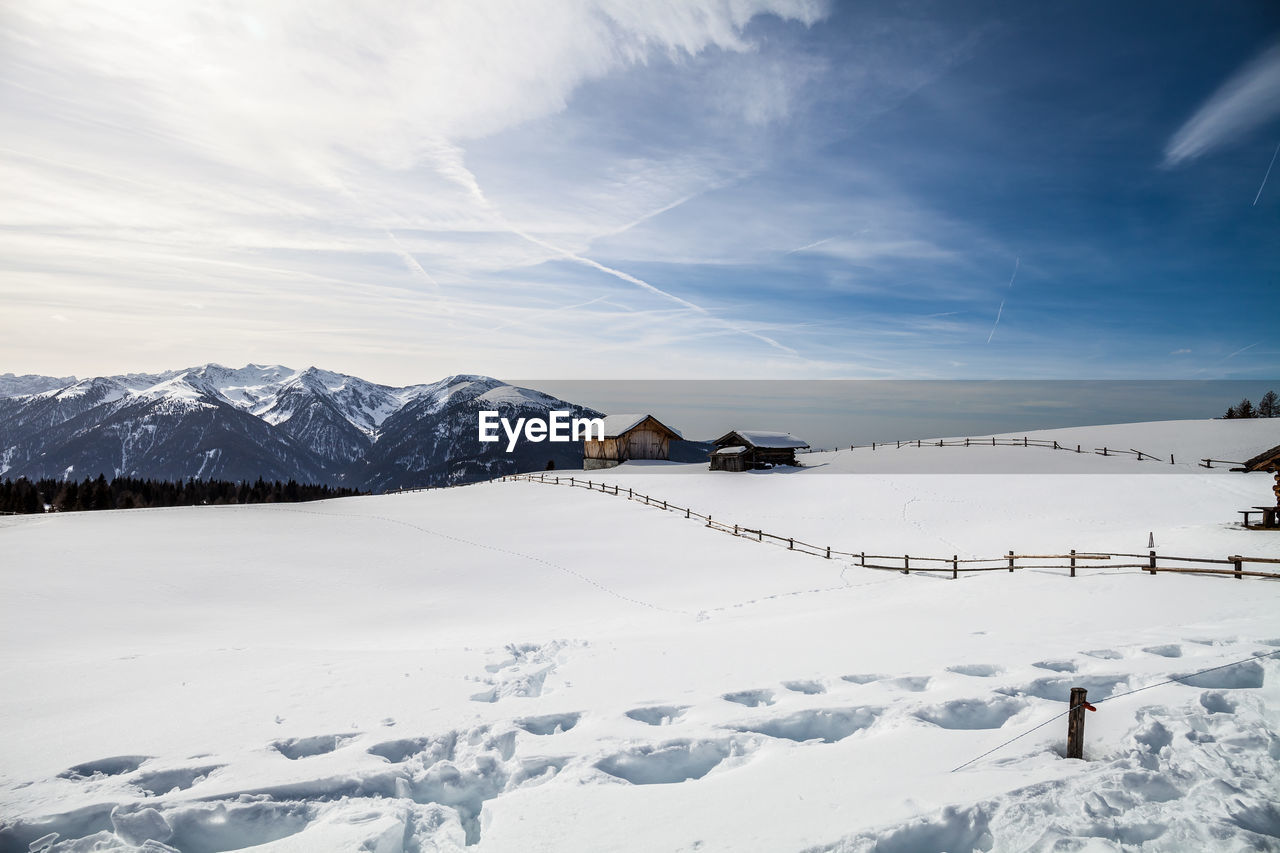 Scenic view of snow covered landscape against sky