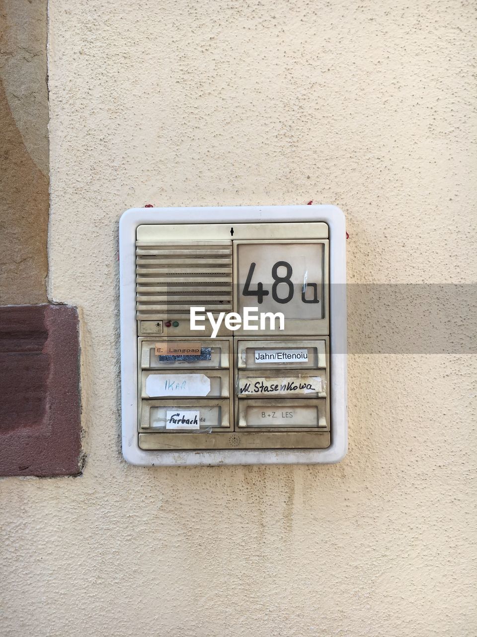 CLOSE-UP OF MAILBOX ON WALL OUTDOORS