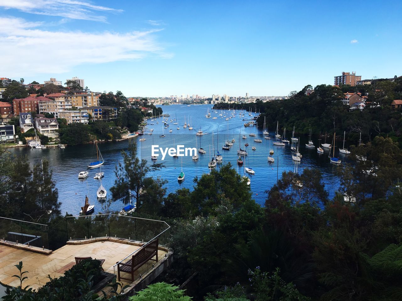 High angle view of boats in sea by buildings