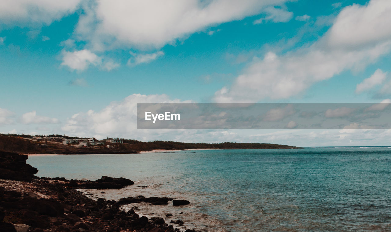 Scenic view of bay against sky